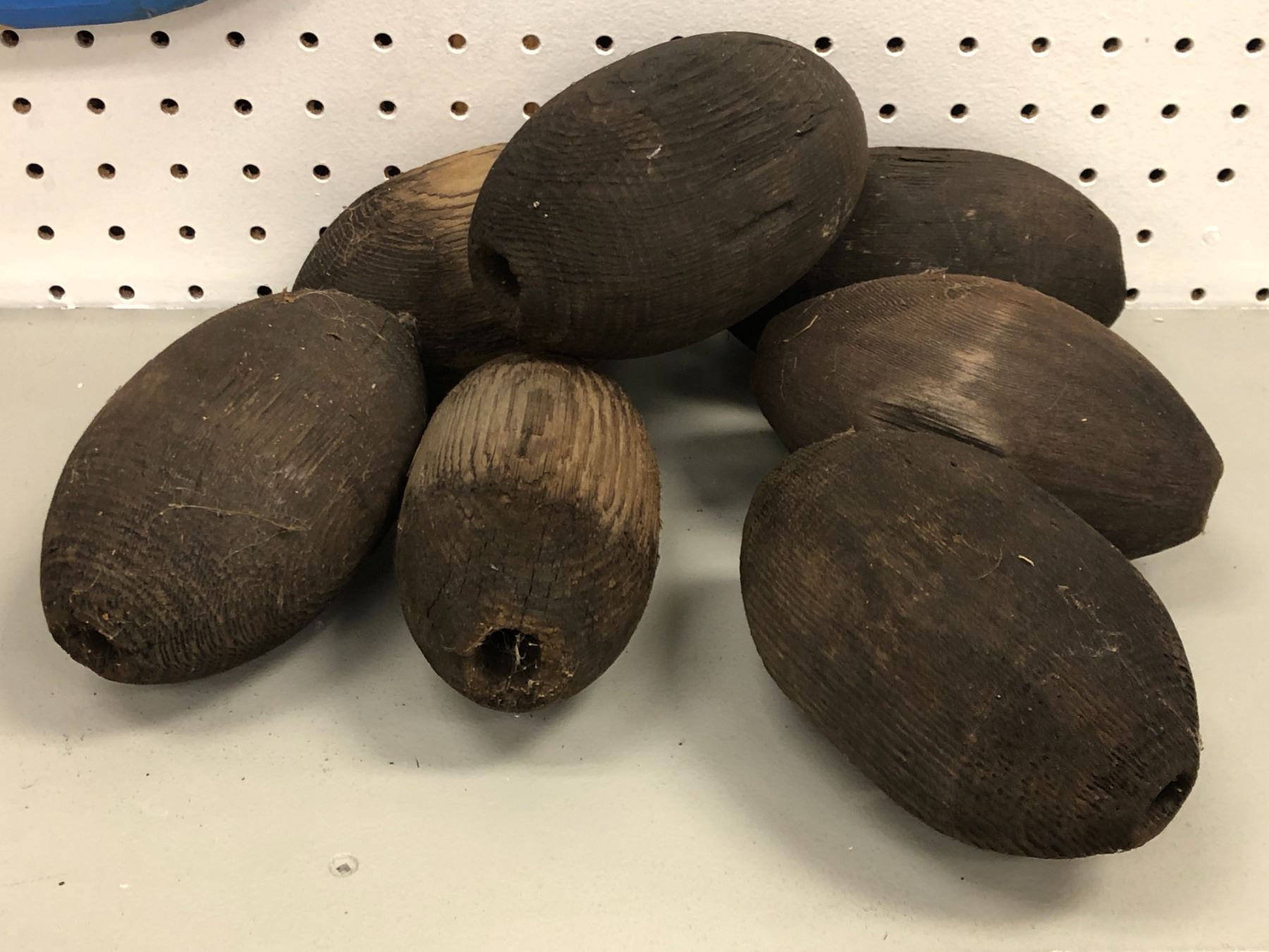 First Nations Fish Net Group of 7 antique First Nations handmade wooden fishing net floats