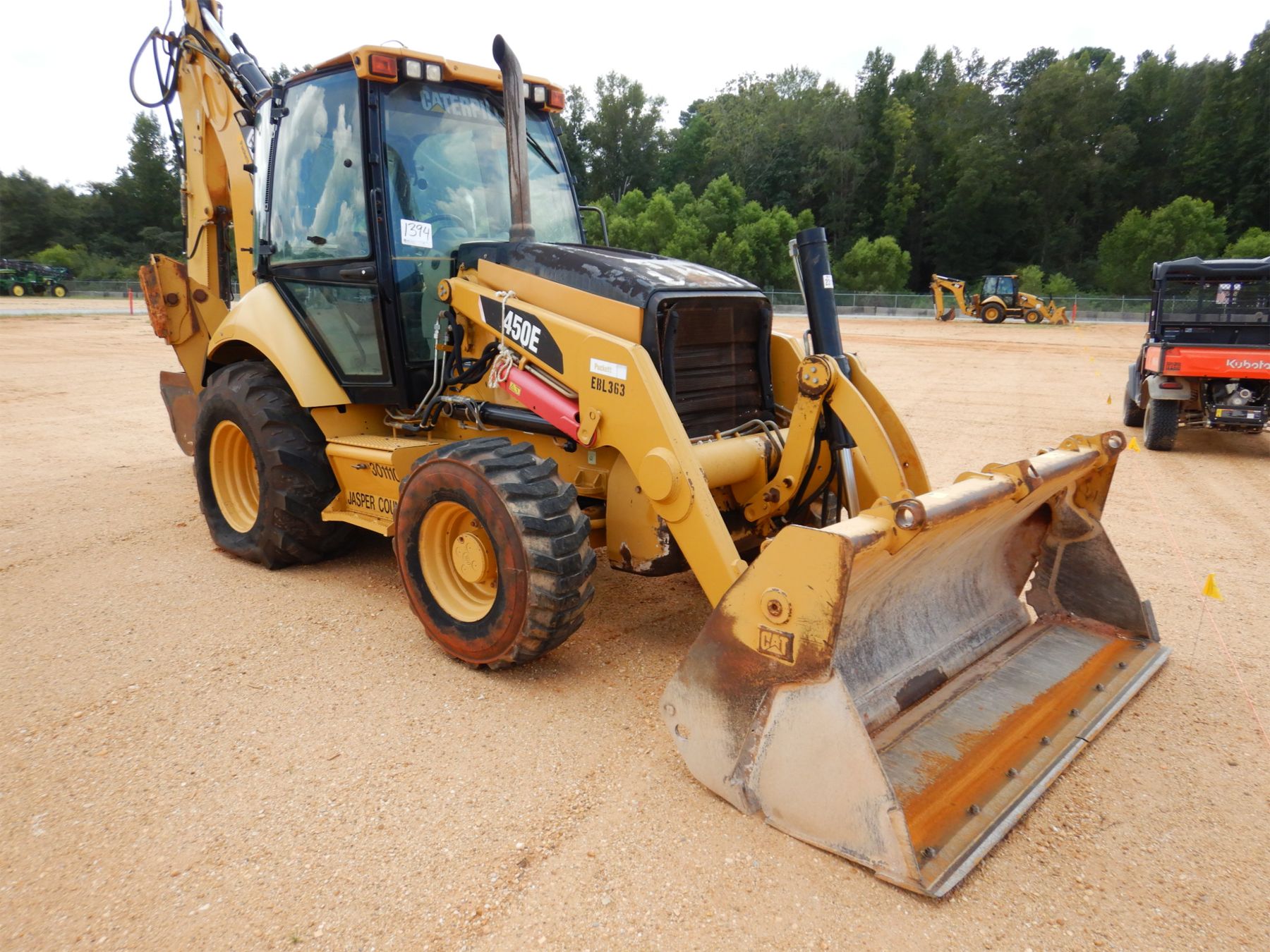 2009 CAT 450E Backhoe J.M. Wood Auction Company, Inc.