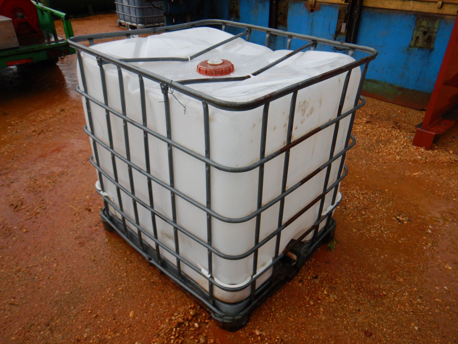 250 GAL PLASTIC STORAGE TANK W/ CAGE Storage Tank J.M. Wood Auction