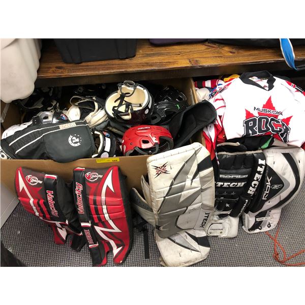Two Large Boxes of Hockey Protective Gear including Goalie Pads and Jerseys from the Hockey Show