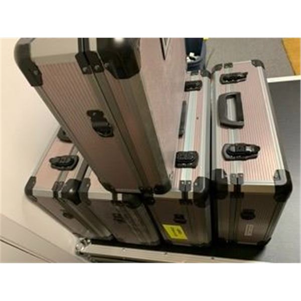 Five Protective Metal Cases - most with unused foam inserts - from a television series "Hero Diamond