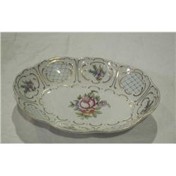 Hollohaza Oval bowl with flower inside center.