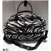 Image 1 : CANVAS ZEBRA DESIGN FOOTED TRAVEL BAG WITH