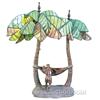 Image 1 : Palm Tree Lamp w/ Woman In Hammock And Man Stading Next