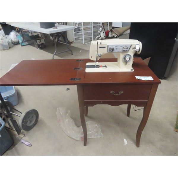 White Cabinet Sewing Machine with Box of Fabric