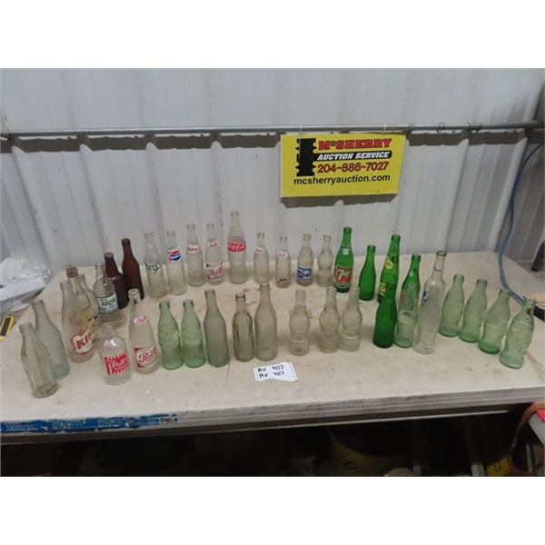 39 Old Pop Bottles; Kik, Zero, Arctic, 7Up, Coke, Pepsi, Crush, plus others