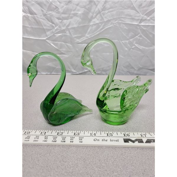 2 green glass swans