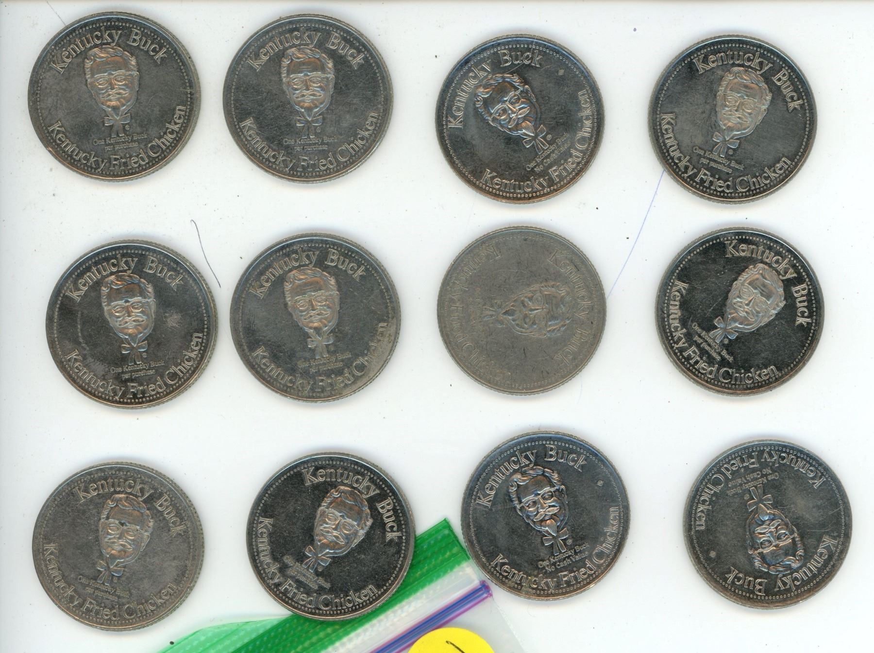 12 Kentucky Fried Chicken Tokens - Schmalz Auctions
