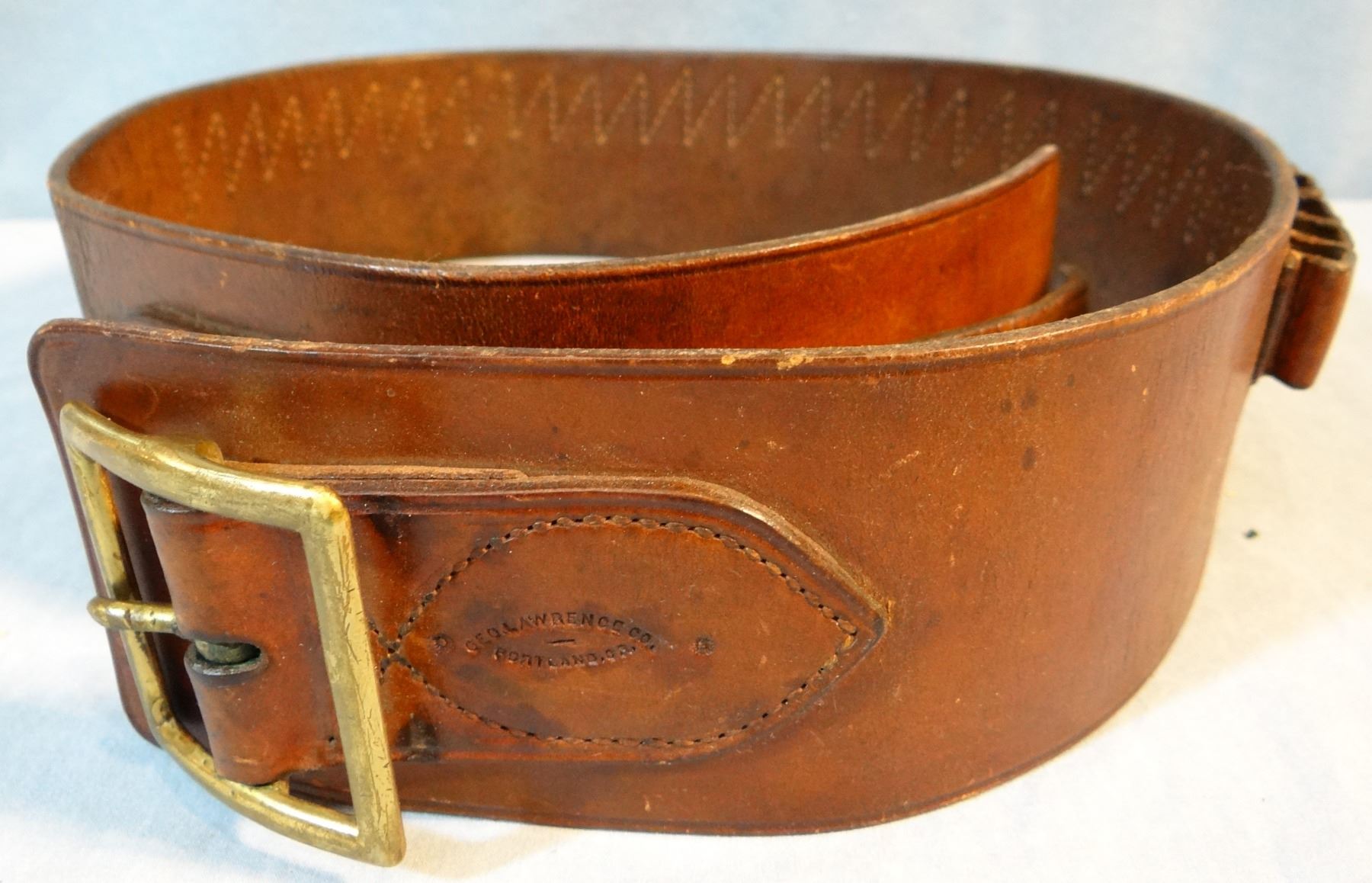 Lawrence cartridge belt, marked and Studded Leather cowboy cuffs