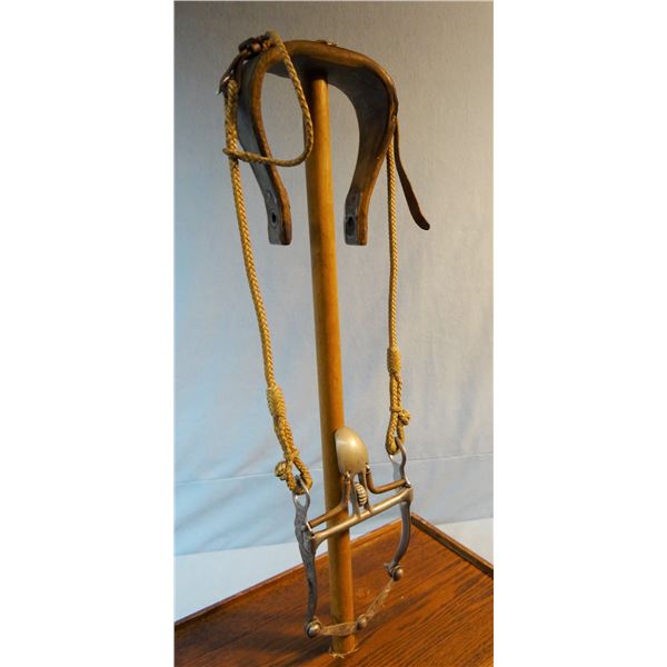 Braided rawhide one ear headstall w/Garcia silver mtd spade bit & romal braided reins.