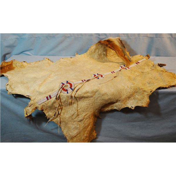 Beaded calf hide, hide is 36" x 36", beaded panel 3" x 29"