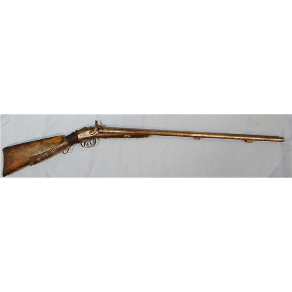 Trade shotgun, dual hammers, marked Delvaux, shows trapper wear, wall hanger