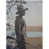 Image 1 : Framed hand tinted old photo of a young man with a rifle standing next to a tree, 10" x 1 6"