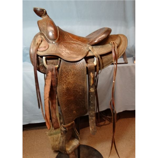 F. Vela stock saddle, 14" seat, double rigged, basket & flower tooled