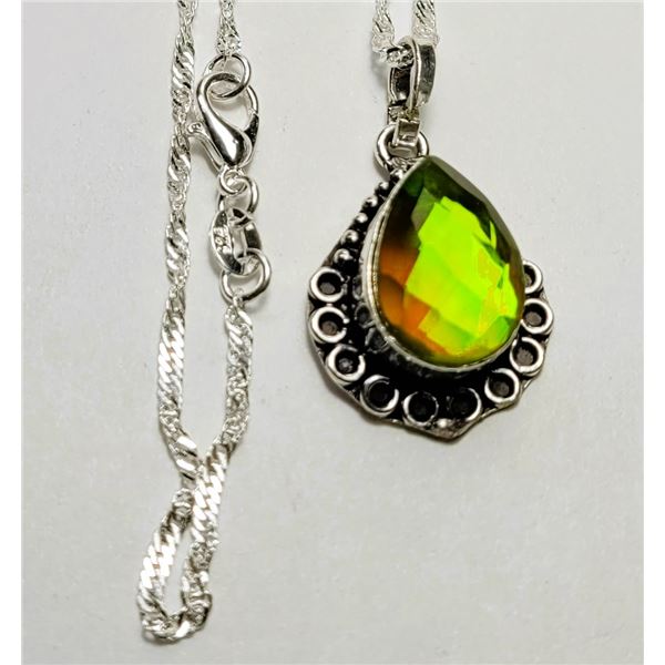 25)  PEAR SHAPED RAINBOW TOPAZ PENDANT SET IN