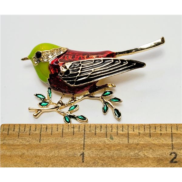 15)  GOLD TONE WITH GREEN, RED AND BLACK ENAMEL