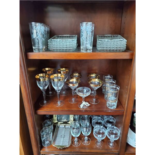 3 Shelves of Silver & Gold Anniverary glass ware