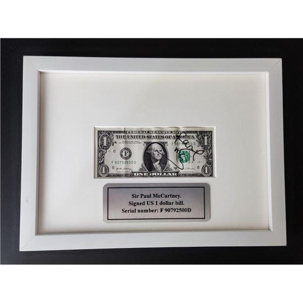 Paul McCartney signed 1 dollar bill.