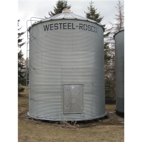 6 ring 14' Westeel on wood floor, c/w ladder and opener. Some rot , couple holes (Located 1.5 miles