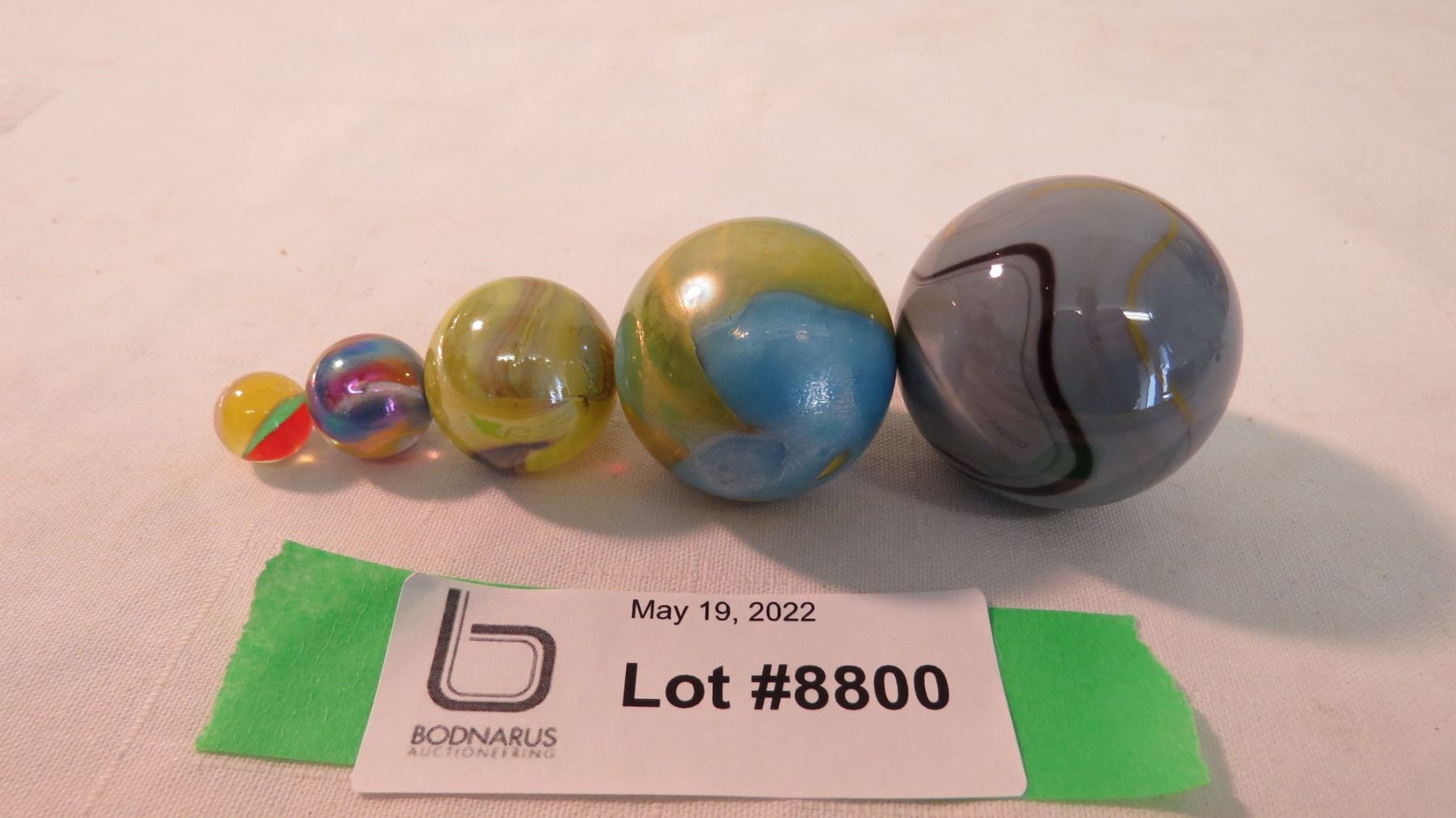 (5) different size marbles