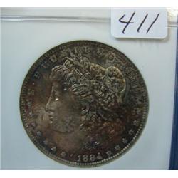 1884-O Morgan Silver Dollar NGC MS64 red toning