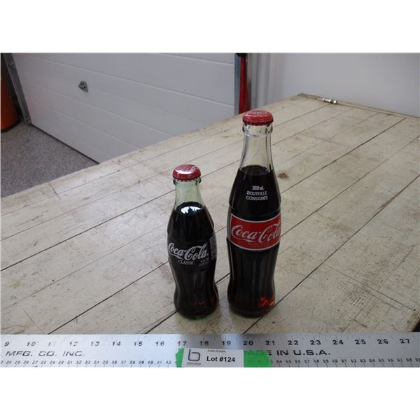 (2) Full Coke bottles