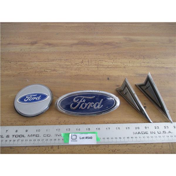 (2) Ford emblems + (2) ?