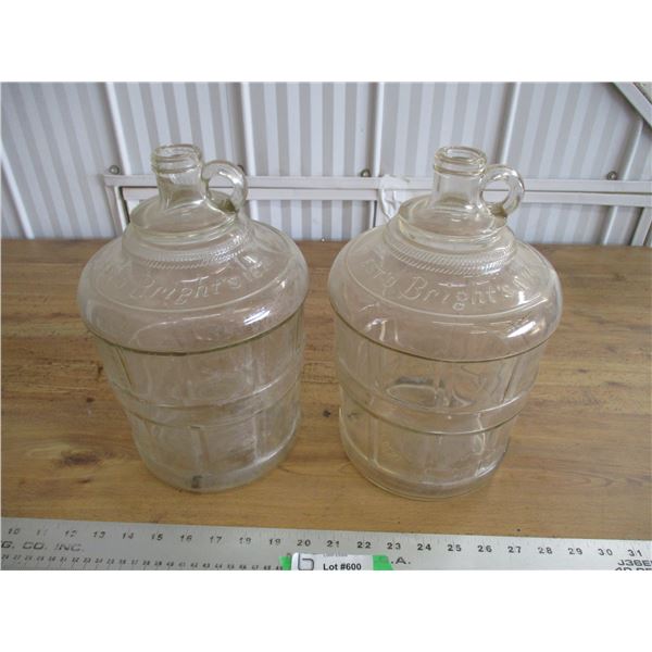 (2) Clear glass jugs (Bright's)