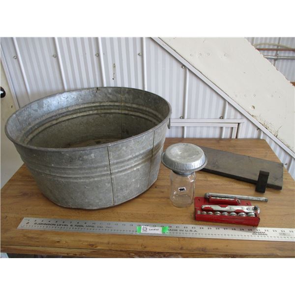 Galvanized tub with chick waterer, wrenches, misc