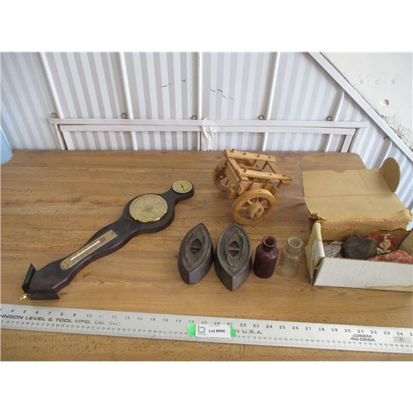 Barometer, sad irons, wooden ox cart