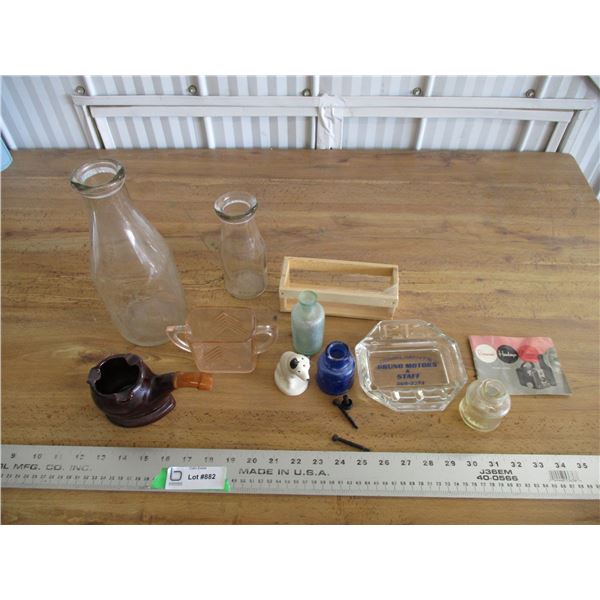 Ashtrays, bottles, creamer