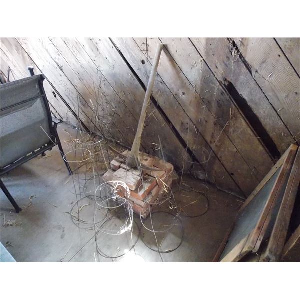 Antique pickaxe, pile of bricks, tomato planters