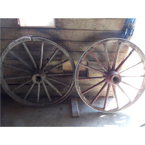 Two large wooden wagon wheels - 52" diameter
