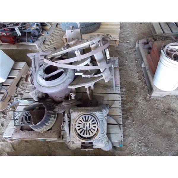 Pallet of antique cast iron stove parts