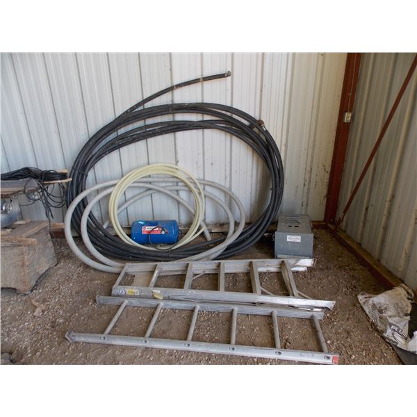 Lengths of hose, damaged ladder, animal trap, air tank