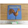 Image 1 : weathervane book - pointing at the wind