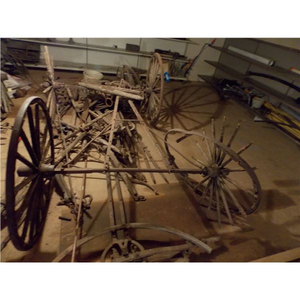 Pile of buggy wheels + parts - must take all - located upstairs