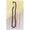 TWO PEARL NECKLACES ONE BLACK ONE CREAM WITH