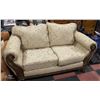 WOOD CARVED STYLE UPHOLSTERED LOVESEAT ALL ITEMS MUST BE REMOVED BY SATURDAY 5PM