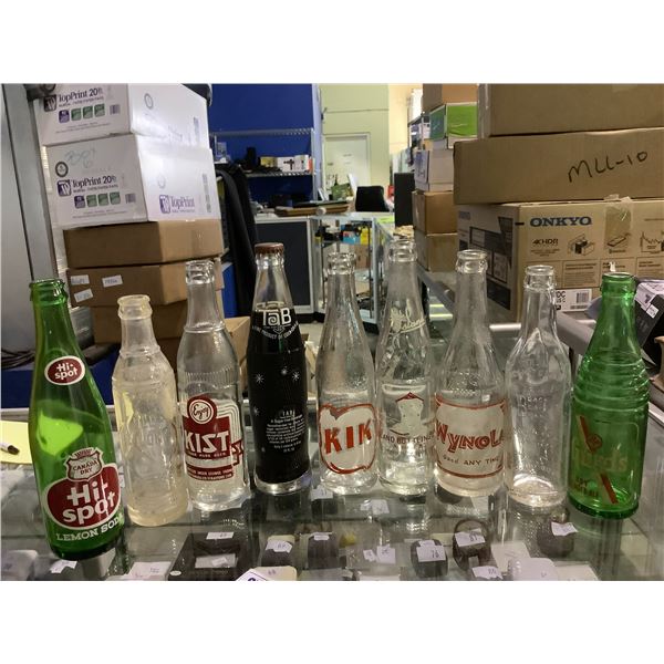9 ASSORTED VINTAGE BOTTLES ONE FULL, BRANDS INCLUDE; TAB, CANADA DRY HI-SPOT, KIST, OLD COLONY,