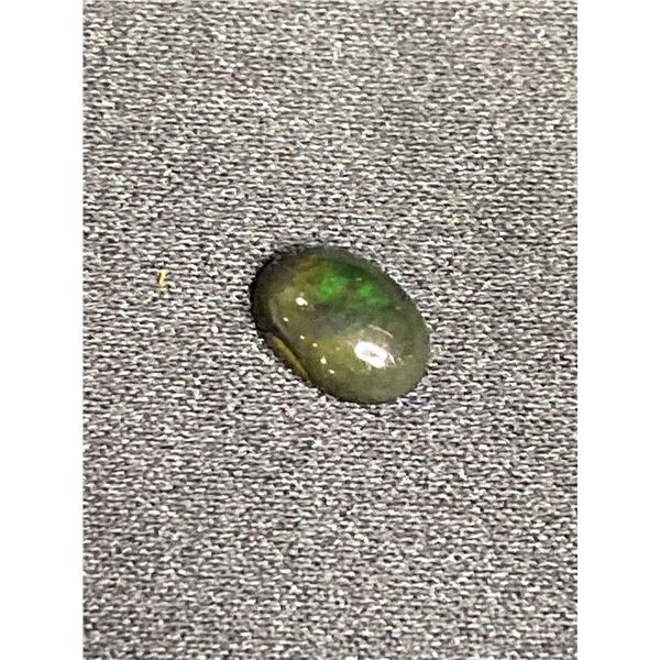 NATURAL WELO BLACK OPAL 0.82CT, 8.64 X 6.05 X 3.28MM, OVAL CABOCHON, ETHIOPIA, HEATED, PLENTY OF