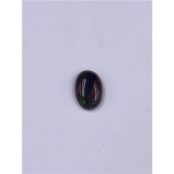 BLACK WELO OPAL 1.735CT, 11.35 X 7.78 X 3.72MM, OVAL CABOCHON, ETHIOPIA, HEATED, LOTS OF PLAY ON