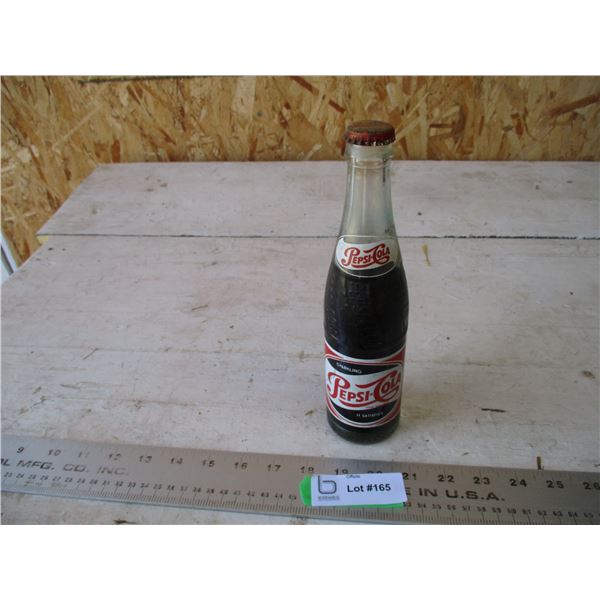 Pepsi-cola bottle full with cap