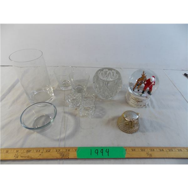 Assorted glass dishes with santa snowglobe