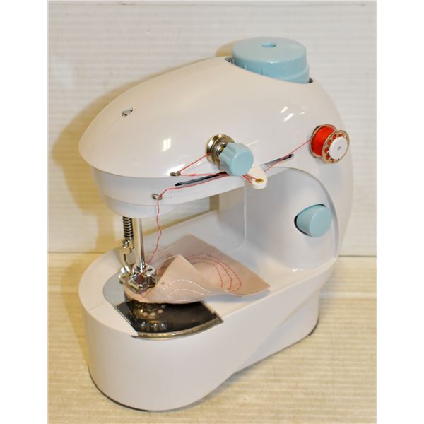 BATTERY OPERATED SEWING MACHINE