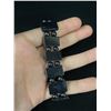 Image 2 : 2 Black Hematite Bracelets. 1 has Religious Pictures On It.