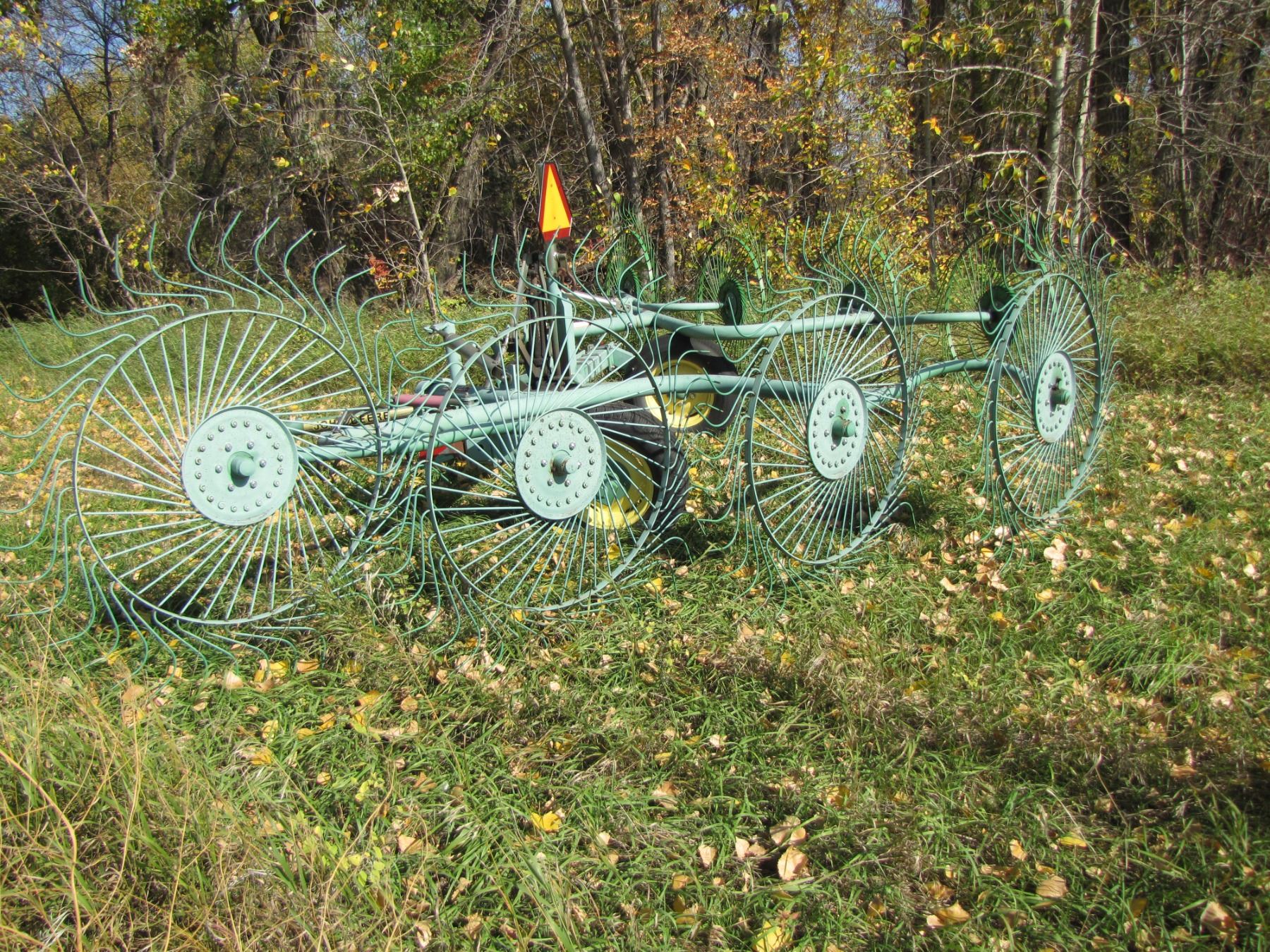 John Deere V rake; works real good; used with 12 foot mower;