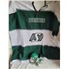 Image 1 : Saskatchewan Roughrider lot. Salt & pepper shakers, miniature Riddal helmet & warm poncho
