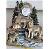 Image 2 : Secret Treasures Wolf family clock statue & Ceramic Native woman with wolves statue.
