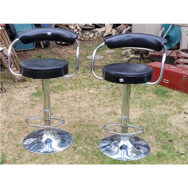 2 adjustable bar stools, one slightly damaged.